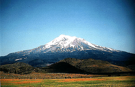 Shasta from the north. The hummocks in the foreground are debris avalanche deposits from Shasta that are between 300,000 and 380,000 years old. These deposits cover an area of 260 square miles (675 square km) in the Shasta Valley and occur over 45 miles (